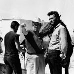 Imagen de rodaje con Sergio Leone en el centro y Clint Eastwood a la derecha.